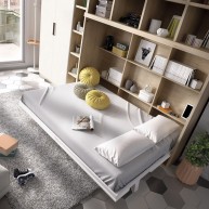 Dormitorio juvenil formado por cama abatible matrimonial con estantería superior y armario