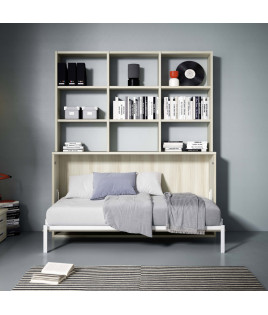 Dormitorio juvenil formado por cama abatible con estantería superior y módulos de salón